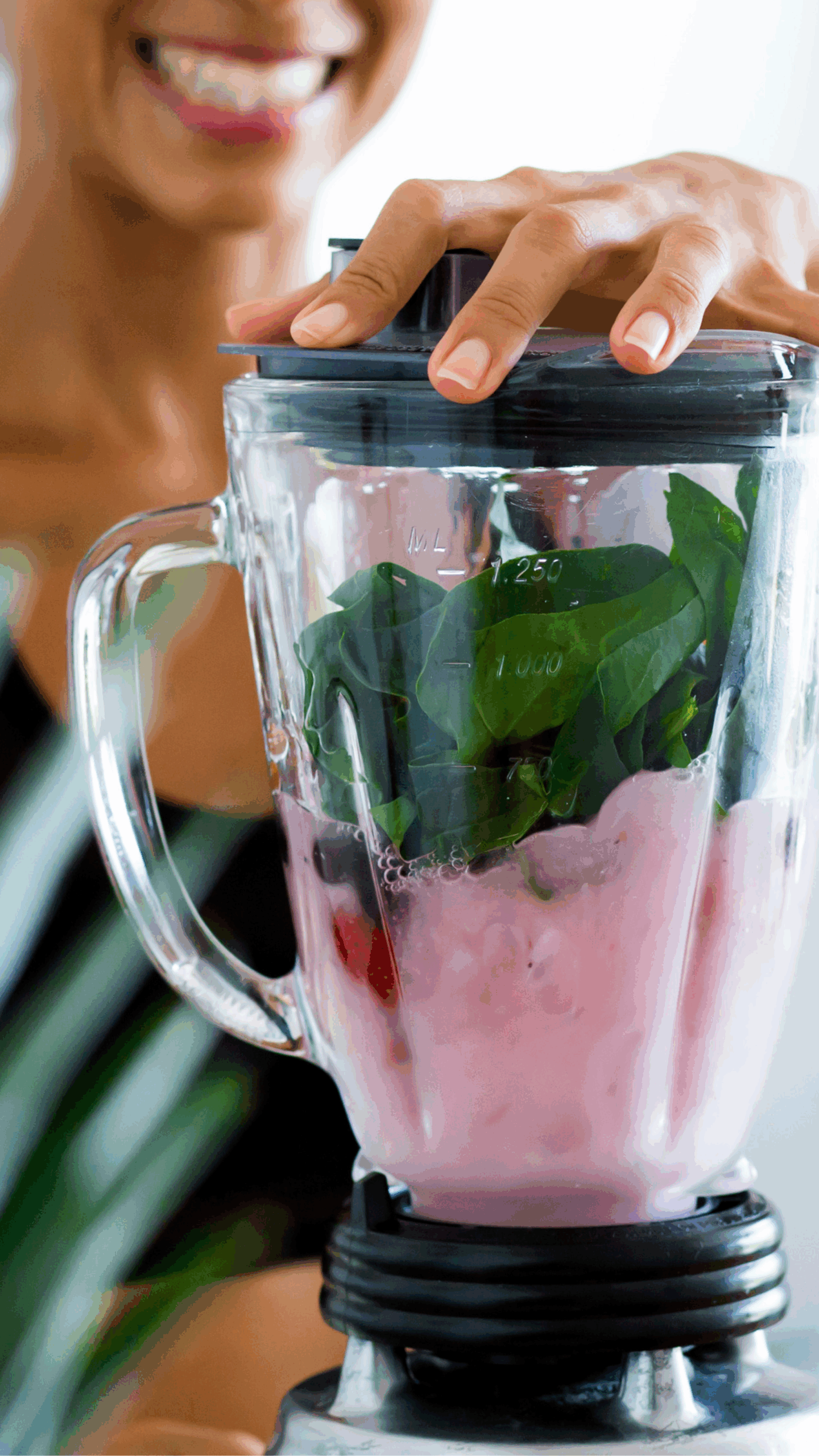 Person blending a smoothie with leafy greens and berries as part of daily habits that support healthy blood sugar.