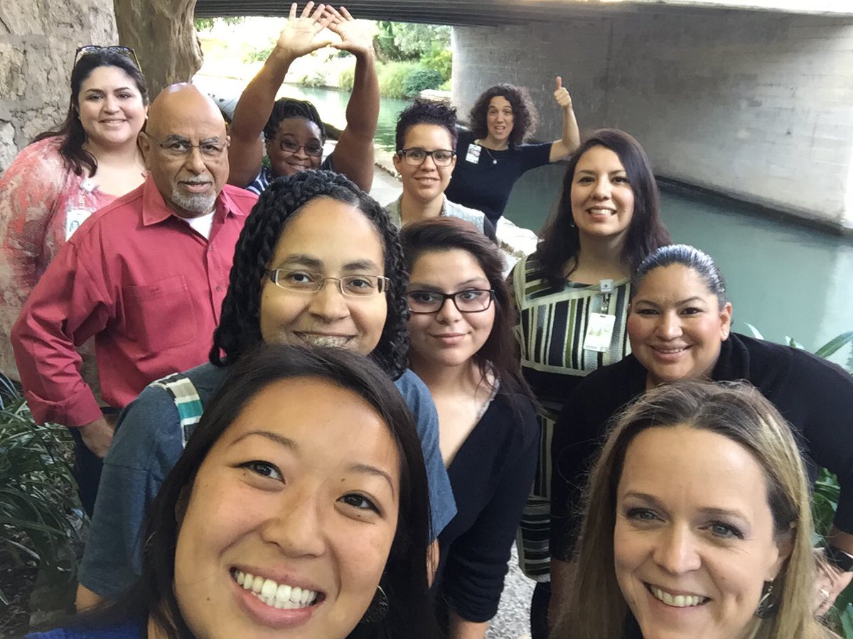 A group of employees posing for a photo during a walk