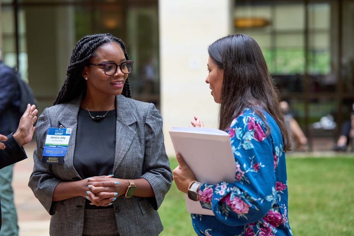 Two women having a conversation at the 2023 Healthier Texas Summit in Austin, TX