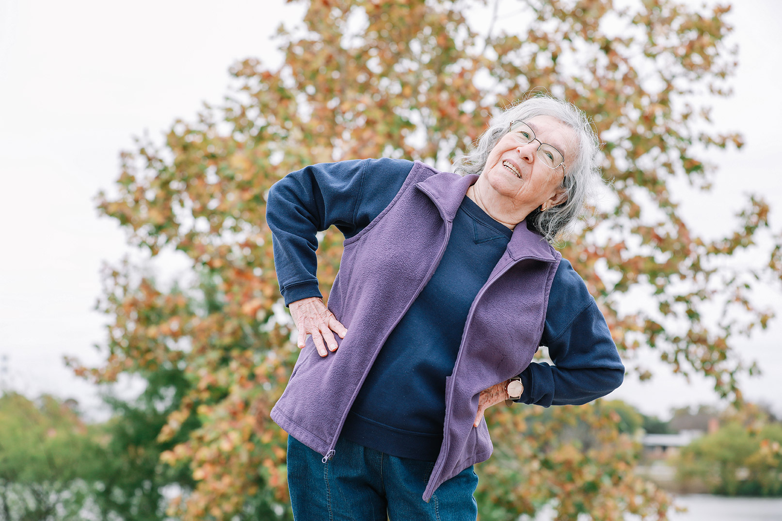 A woman stretching in a park